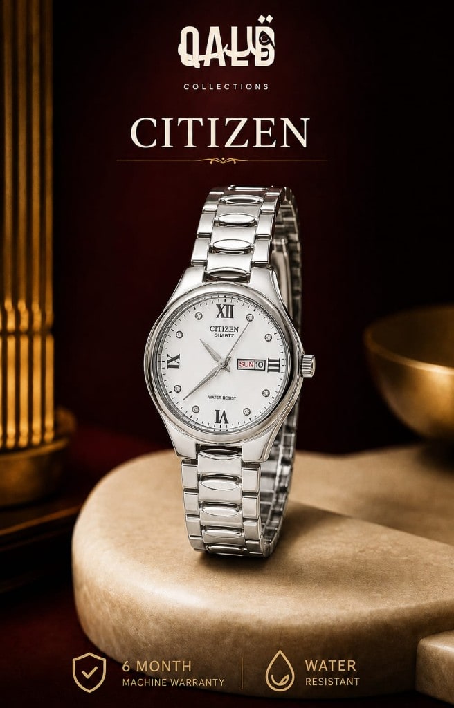Citizen quartz day-date watch with a silver-white Roman numeral dial on a cream stone pedestal