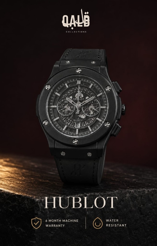 Hublot matte black chronograph on dark stone with a burgundy atelier backdrop